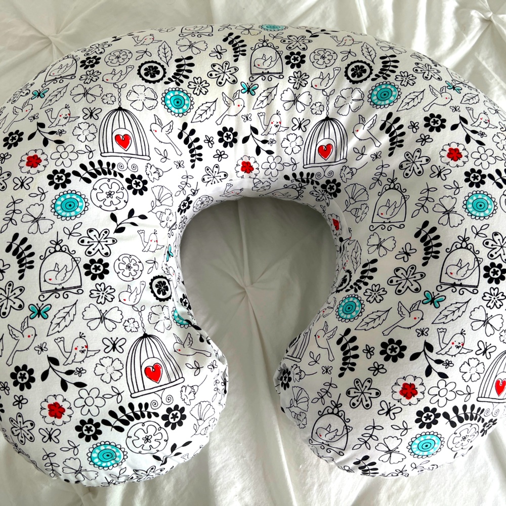 Boppy nursing pillow and extra cover.